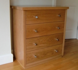 A solid Oak four drawer unit. Built in Oak throughout, with dovetail drawers on fully extending runners. Stainless steel handles complete the contemporary design