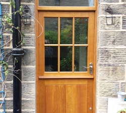 Solid Oak stable door built at 60mm thick to accommodate energy efficient double glazing.  Double skinned &  grooved lower door, glazed top door.