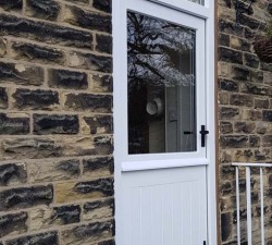 58mm thick Sapele hardwood, stable door.  Tongue & grooved lower half.