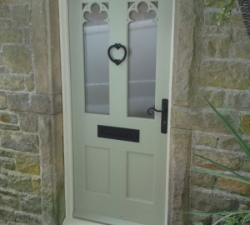 A hand-painted, hardwood, carved fretwork door