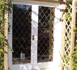 Leaded glass French windows, built in Merranti hardwood