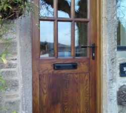 A solid Ash door with six windows in a solid Ash frame for a non-standard sized opening