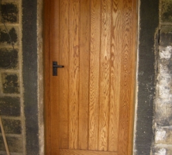 A solid Oak panelled internal porch door with a solid Oak frame. Oiled finish.