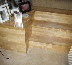 Overlaid Engineered Ash Stairs. Engineered Ash has been laid on these three stairs and adjoining shelf, making the stairs a feature in a room which consists of two levels