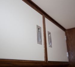 Bespoke overhead cupboards in a van conversion