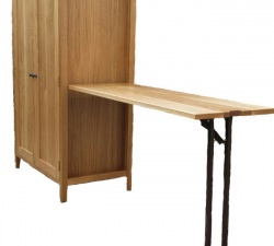 An office unit with an integral desk, built in solid Oak throughout.  The desk slides back into the unit as a side panel, when not in use.