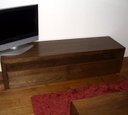 Bespoke TV unit built in veneered Oak and stained dark to match the existing furniture in the room.
