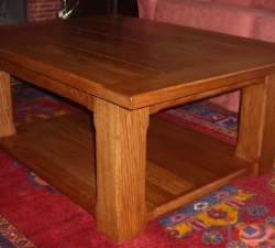 Oak Coffee Table with Shelf. A solid Oak, coffee table which incorporates a lower shelf. Completed in an antique finish to compliment the existing furniture in the clients home