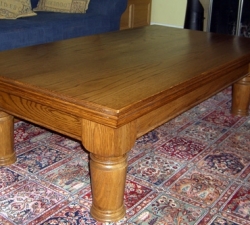 A traditional coffee table in solid Dark Oak with hand turned legs