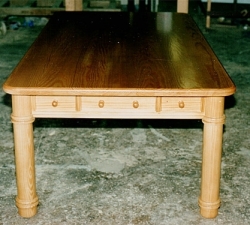 Large Country Kitchen Table. Large country table built in Southern Yellow Pine incorporating cutlery drawers. Seats eight people. Features simple turned legs