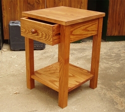 A telephone table, built in solid Ash incorporating a drawer with matching handle and lower shelf. Built to compliment the clients existing bedroom furniture