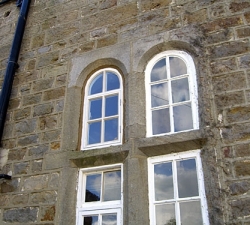 This is a hardwood arched window frame, built to match the existing windows.