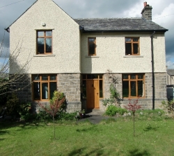 A set of solid Oak windows which preserve the clients existing stained glass windows. The stained glass windows were carefully removed, trimmed to fit the new casements, repaired where necessary and then sealed into the new windows protecting the stained glass.
