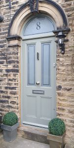 External hardwood door with sandblasted glass with an etched border